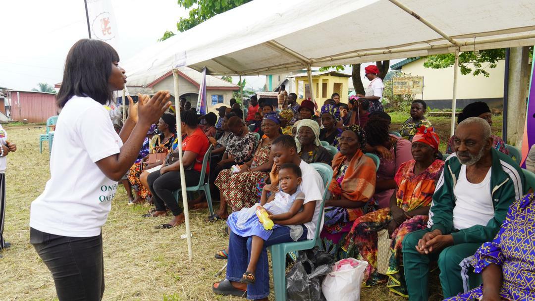 Community Health worker giving a health talk to participants during one of the community health campaign.